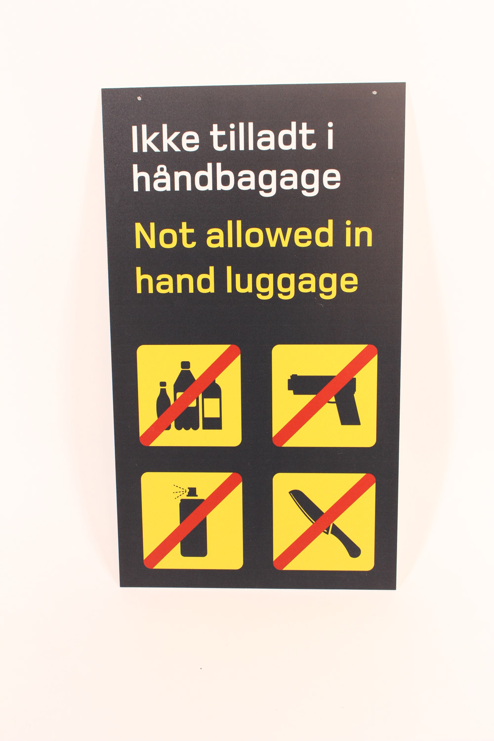 Skilt Ikke tilladt i håndbagage...